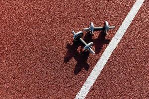 Top view of dumbbells that is on the ground photo