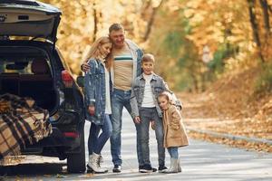 Cheerful people. Happy family is in the park at autumn time together photo