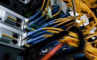 Close up view of internet equipment and cables in the server room photo