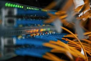 Close up view of internet equipment and cables in the server room photo