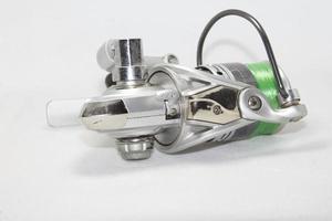 Fishing reel on a white background. Use lights and flash for sharpness in the studio. photo