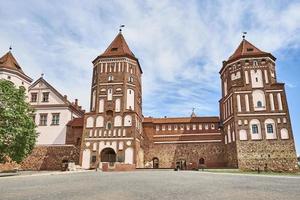 Mir castle complex in summer day with blue cloudy sky photo