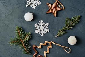 Christmas decorations on dark background, top view photo