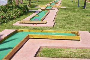 Miniature golf course in hotel. Entertainment for tourists at hotel photo