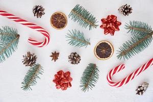 Decoration made of fir tree branches, pine cones and sweets photo