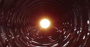 A rotating dark metal tunnel with walls of ribs and lines in the form of a circle with reflections of luminous rays. Abstract background photo