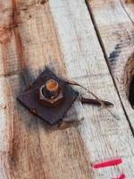 This is a bolt with a rusty nut photo