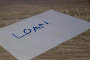A paper with the words Loan photo