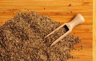 Whole dill seeds close-up. Anetum graveolens organic fruit for medicinal herbs concept. Spices, seasonings and condiments. Growing dill. The texture of the seeds. photo