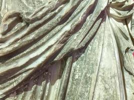 texture, clay sculpture made of plastic material. on the texture of scuffs, chips, cracks. volumetric texture with the texture of the fabric and the silhouette of a girl photo