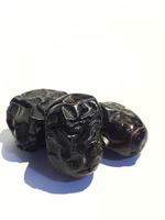 Isolated photo of three ajwa dates. Ajwa dates or also known as Prophetic Dates.
