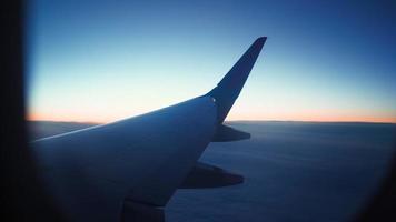 View from the window of a flying plane to the beautiful clouds. Air transport concept. video