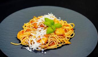 Spaghetti Rigate - italian pasta with scallops and shrimps photo