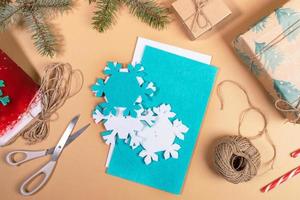 Step by step instruction of making DIY Xmas toy snowflake. Step 2 - Take out substrates with applied snowflakes. photo