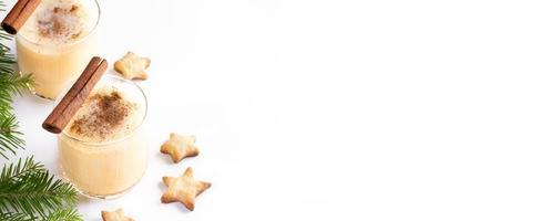 Christmas banner with traditional drink eggnog and pastries cookies stars on white. Copy space. photo