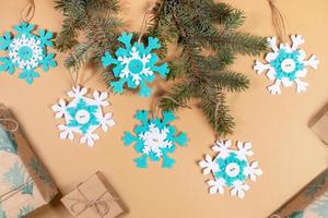 Step by step instruction of make DIY Xmas toy snowflake.Step 8 - Snowflakes are ready. Decorate Xmas tree with them. photo