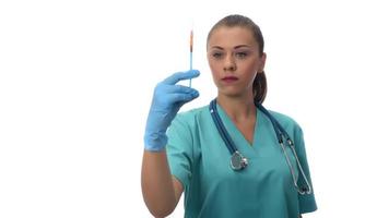 Portrait of serious doctor woman holding syringe with covid19 vaccine. photo