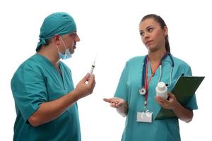medical team doctor and nurse holding medications. health and medicare concept photo