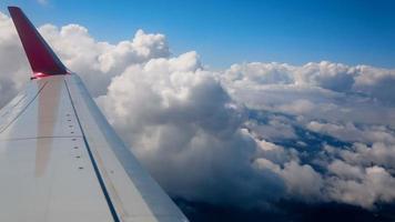 The aircraft is climbing, flying through the clouds, the view from the airplane video