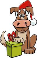 divertido perro de dibujos animados con regalo en Navidad vector