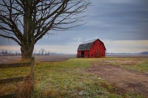 Old abandoned barn in rural Michigan farm lands photo