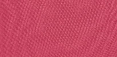 Texture of smooth knitted sweater with pattern. Handmade knitting wool or cotton fabric texture. Background of Large knit pattern with knitting needle or crochet. Color Of The Year 2023 - Viva Magenta photo