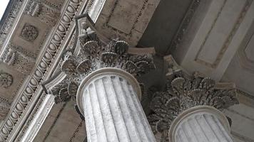 Classic architectural column. Details of the architecture of a historical building. Element of exterior building with columns and Stucco molding on the ceiling of Cathedral in St. Petersburg, Russia. photo