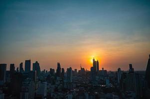 Bangkok Cityscape view with beautiful Sunset and silhouette of the building.Bangkok is the capital and most populous city of Thailand. photo