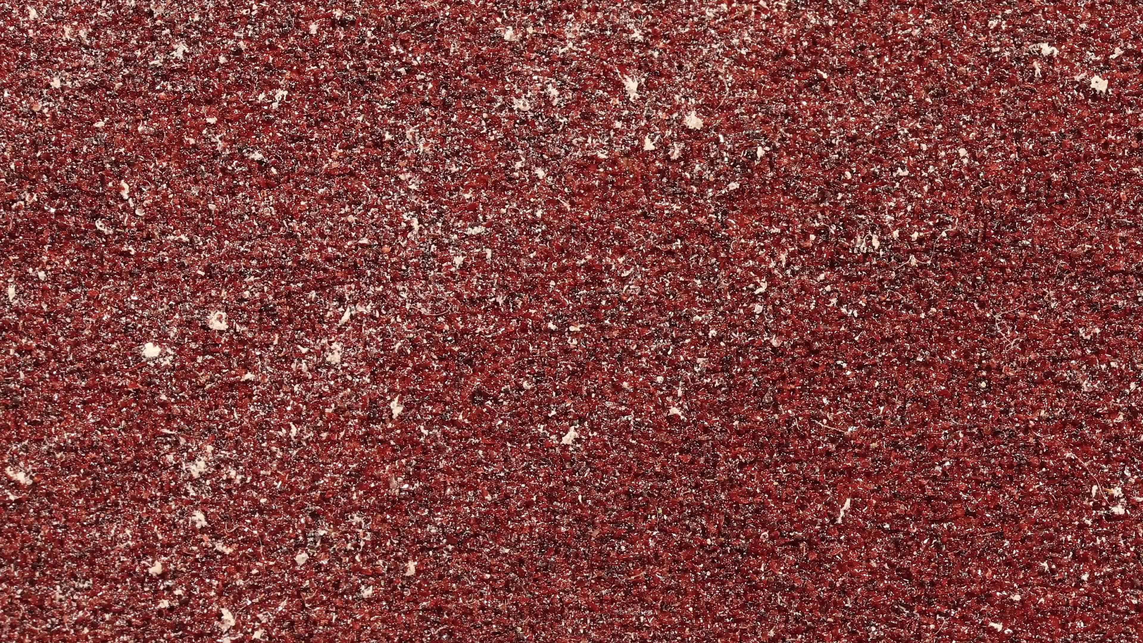Red Sandpaper Texture Seamless Loop. Rough Grit Abrasive Background