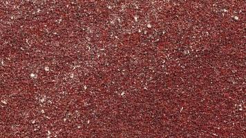 röd sandpapper textur sömlös slinga. grov grus skrovlig bakgrund. Begagnade spannmål smärgel bakgrund. video