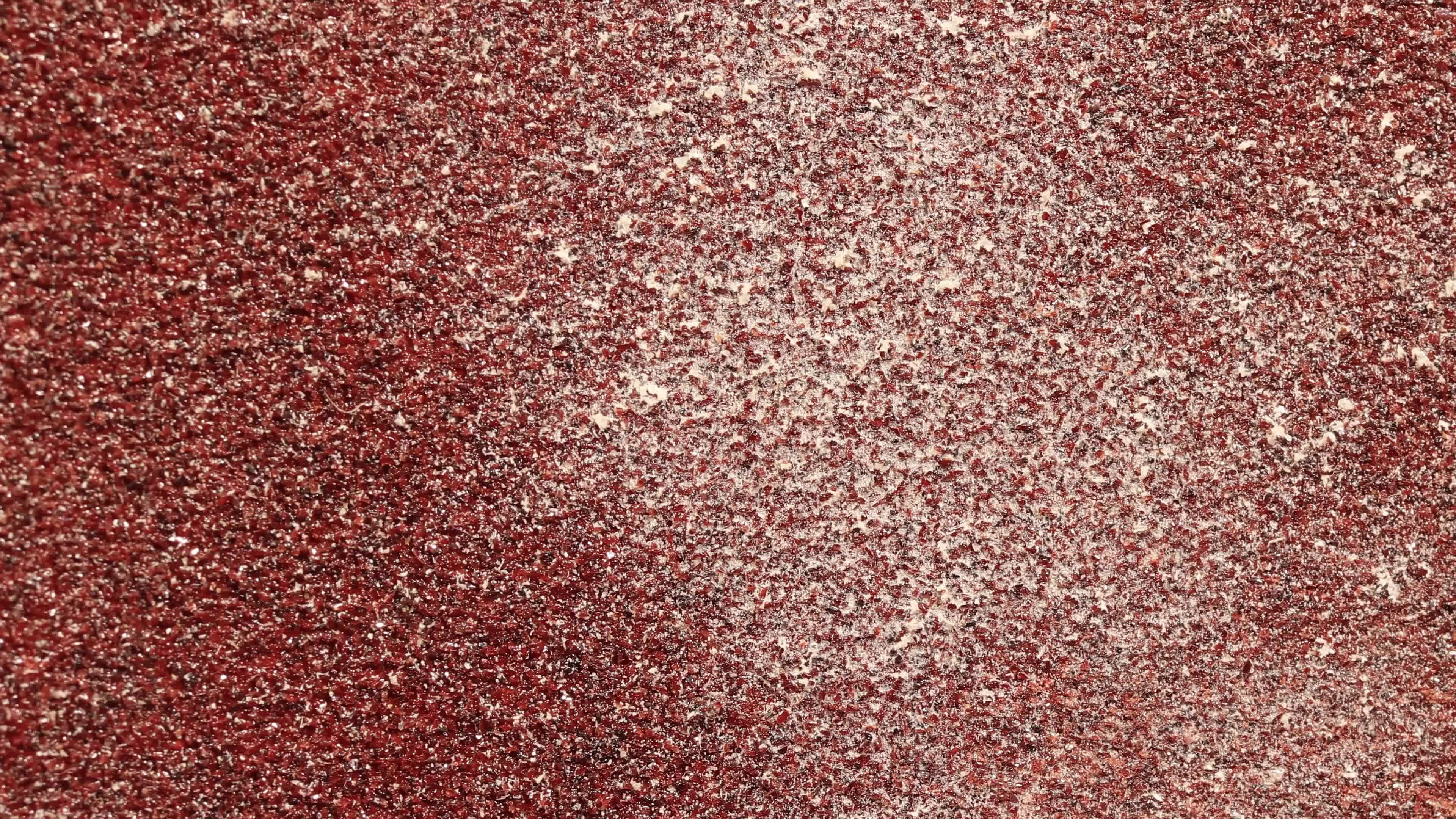 Red Sandpaper Texture Seamless Loop. Rough Grit Abrasive Background