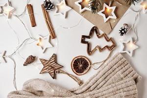 Wooden christmas decorations on white background. Cozy home and hugge background photo