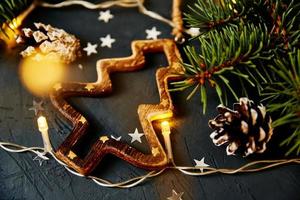 Christmas decorations on dark background, top view photo