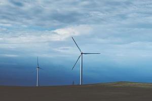 Wind turbine in the field, toned photo. Wind power energy concept