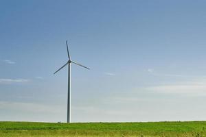 Wind turbine in the field. Wind power energy concept photo