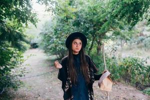 Young woman against the background of an old orchard. photo