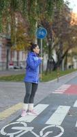 Close-up of an sports women warming up legs before jogging photo