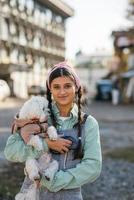 Beautiful young woman enjoying outdoors with her adorable Maltese dog. photo