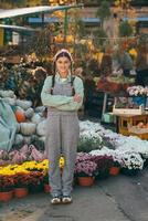 Farmer female poses for the camera in front of the counter. photo