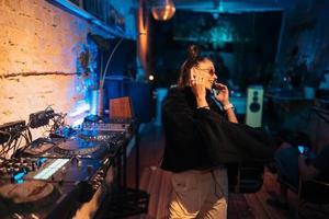 Beautiful female dancing in a small club photo