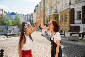 Two funny friends outdoors in the street photo