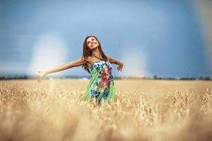 girl in wheat meadow photo