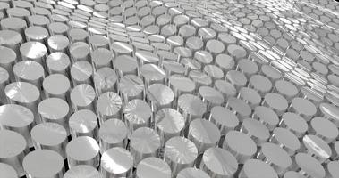 abstract grid of waves of round circles of cylinders of metal coins from stainless steel with reflections on iron. Abstract background photo