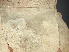 texture. ancient vase with damage. the vase has chips and cracks. mangled texture. ancient vase. worn texture, background photo