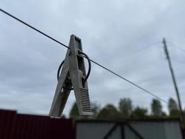 Clothespins on a clothesline for drying clothes photo