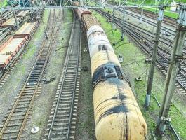 railroad in the city. metal rails. on the road there are cargo, round-shaped commodity tanks carrying gasoline, oil and other liquids photo