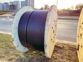 power line cable twisted into a ball. black long cable. laying a cable to supply the microdistrict with electricity photo