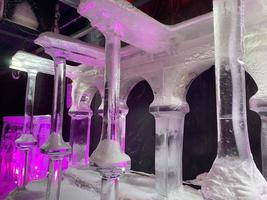 ighted fireplace in the world-renowned seasonal Ice Hotels spectacular bar illuminated in blue photo