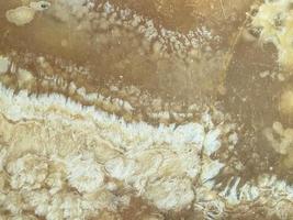 texture, smeared mud from sand and water. stains on the surface. brown and white clay mix. the background. 3d abstract texture photo