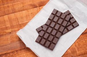 dark chocolate bar on white background photo